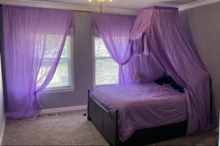 Purple Bedroom with Canopy Curtains